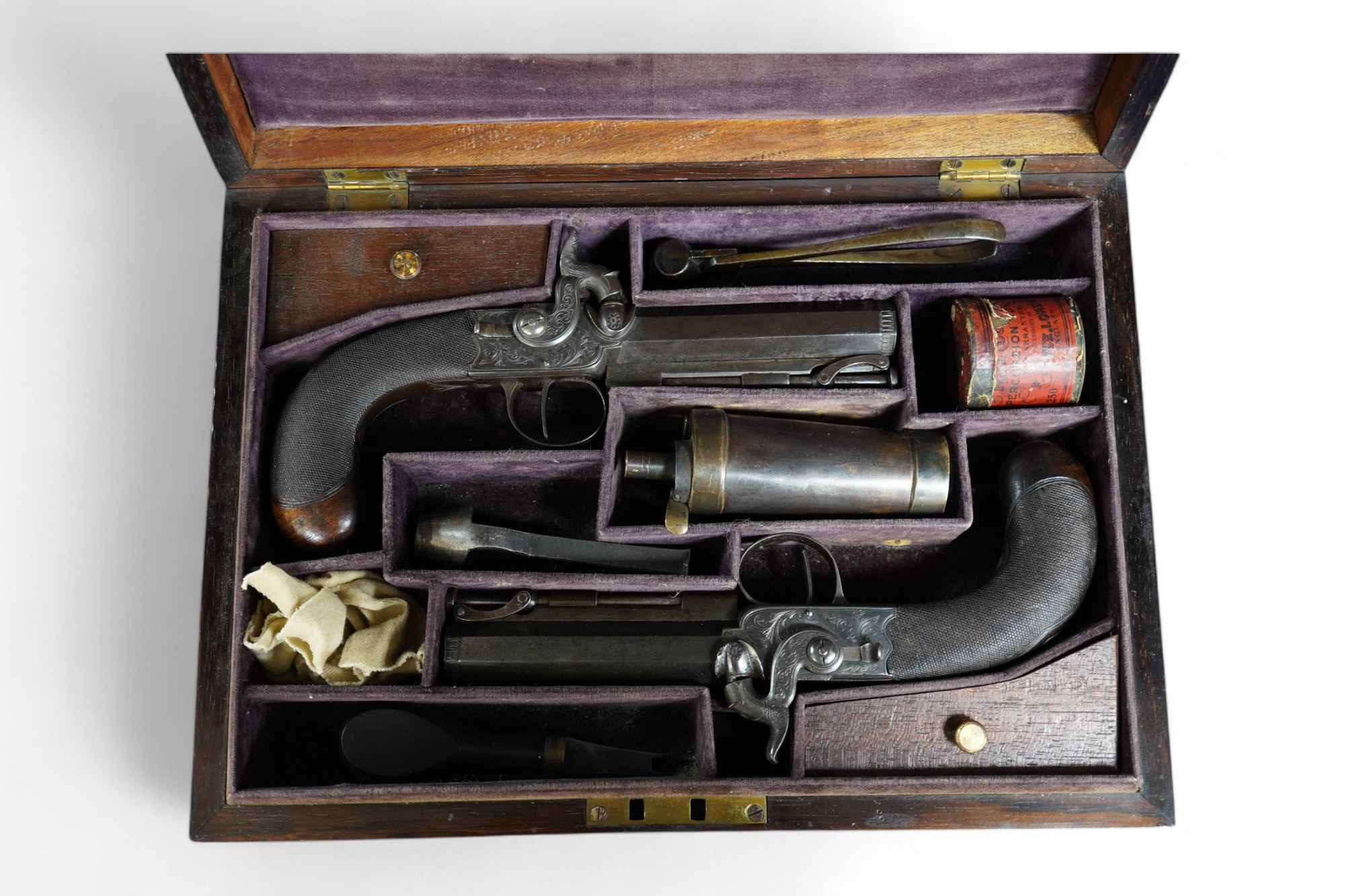 A pair of rosewood cased Blake & Co. London percussion cap travelling pistols, with octagonal barrels, engraved Blake & Co. London, Birmingham proof marks, side hammers, sliding safety bolts, swivel ramrods, foliate engr